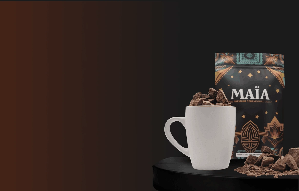 White mug with chocolate chunks, next to a decorative cacao package.